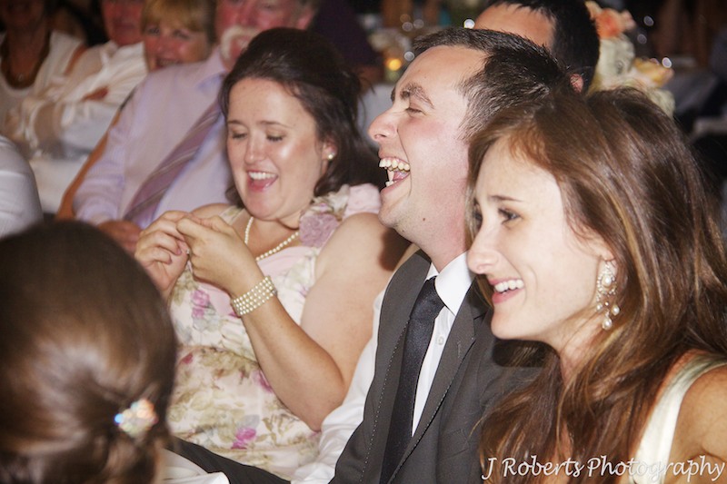 Groom laughing at wedding speeches - wedding photography sydney